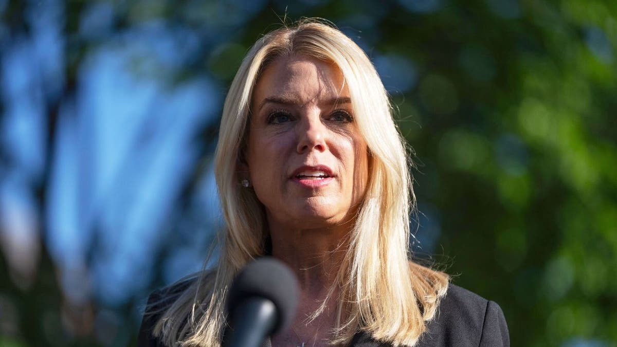 Attorney General Pam Bondi talks to journalists outside the White House, on Wednesday, May 7, 2025, in Washington. (AP Photo/Mark Schiefelbein)
